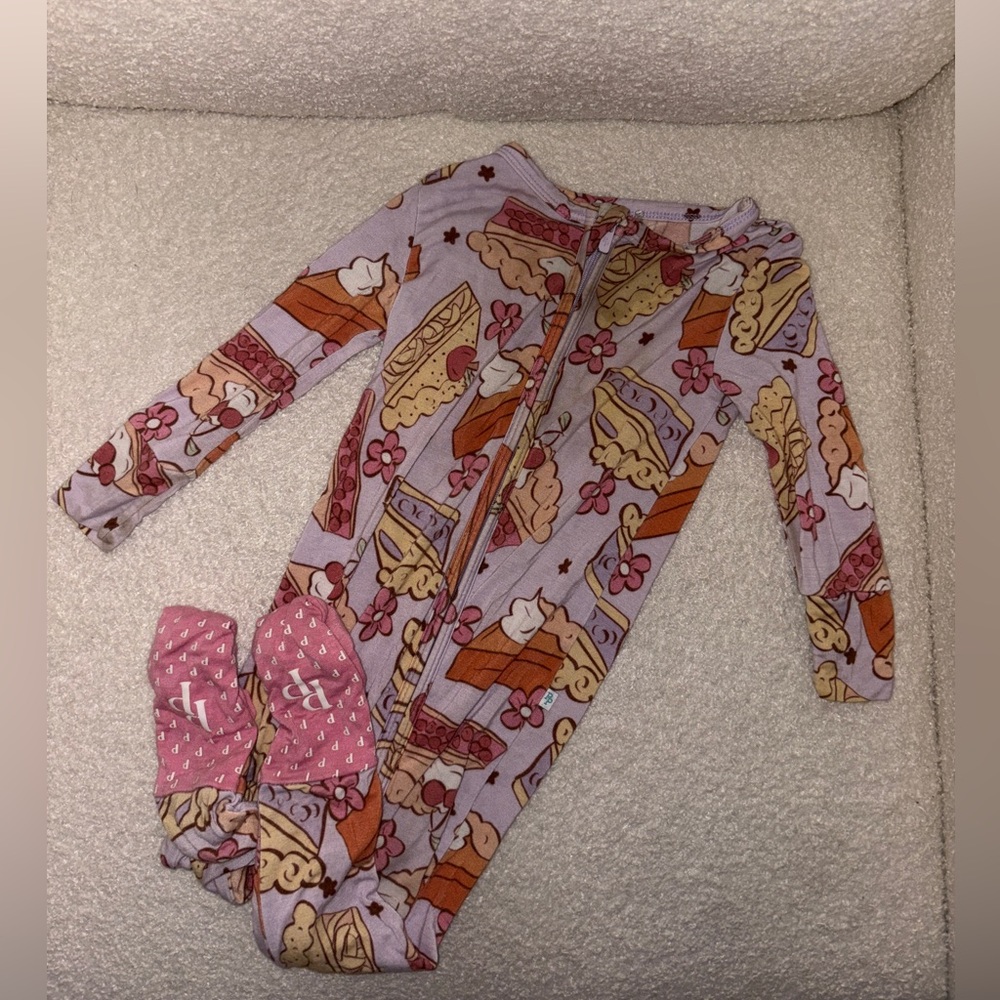 Posh Peanut Peanut zippy footie pajama featuring a pie and floral print